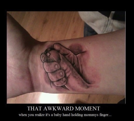 Tattoo Fail It's supposed to be a Baby's hand holding a finger